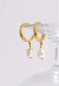 Earrings with freshwater pearl pendants.